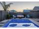 Stunning backyard pool featuring a fire pit and seating area for memorable evenings at 3661 E Appaloosa Dr, San Tan Valley, AZ 85140