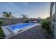 Backyard oasis with a refreshing pool, lounge chair, and lush landscaping for ultimate relaxation at 3661 E Appaloosa Dr, San Tan Valley, AZ 85140
