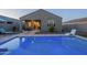 Inviting backyard pool with a comfortable lounge chair and covered patio seating, perfect for outdoor relaxation at 3661 E Appaloosa Dr, San Tan Valley, AZ 85140
