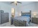 The bedroom boasts neutral paint and carpet, and matching wood furniture at 3661 E Appaloosa Dr, San Tan Valley, AZ 85140