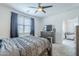 The carpeted bedroom features neutral paint, ceiling fan, and a walk-in closet at 3661 E Appaloosa Dr, San Tan Valley, AZ 85140
