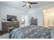 The carpeted bedroom has neutral colors, a ceiling fan, and walk-in closet at 3661 E Appaloosa Dr, San Tan Valley, AZ 85140