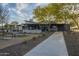 Community clubhouse featuring an outdoor kitchen, pergola, seating area, and manicured landscaping at 3661 E Appaloosa Dr, San Tan Valley, AZ 85140