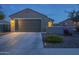 Charming home features a well-maintained exterior, two-car garage, and manicured landscaping, perfect for suburban living at 3661 E Appaloosa Dr, San Tan Valley, AZ 85140