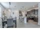 Open-concept kitchen with stainless steel appliances and island seating at 3661 E Appaloosa Dr, San Tan Valley, AZ 85140