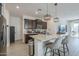 Features include stainless steel appliances, granite countertops, and a cozy breakfast bar at 3661 E Appaloosa Dr, San Tan Valley, AZ 85140