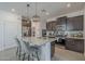 The kitchen has stainless steel appliances, granite countertops, and a breakfast bar at 3661 E Appaloosa Dr, San Tan Valley, AZ 85140