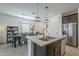 Open-concept featuring stainless appliances, island with sink, and a spacious dining area at 3661 E Appaloosa Dr, San Tan Valley, AZ 85140