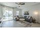 Inviting living room with a stylish sofa and sliding glass doors to the backyard at 3661 E Appaloosa Dr, San Tan Valley, AZ 85140