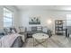 Bright living room featuring a comfortable sofa, designer rug, and stylish decor at 3661 E Appaloosa Dr, San Tan Valley, AZ 85140