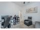 Bright office features a recliner, desk, and book shelves, all on soft carpeting at 3661 E Appaloosa Dr, San Tan Valley, AZ 85140