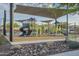 Community playground featuring modern play structures and covered shade structures for to enjoy at 3661 E Appaloosa Dr, San Tan Valley, AZ 85140