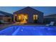 Beautiful backyard pool with covered patio and modern outdoor furniture, perfect for relaxing evenings at home at 3661 E Appaloosa Dr, San Tan Valley, AZ 85140