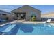 Backyard pool showcases the home's exterior, patio, and outdoor dining area with a relaxing atmosphere at 3661 E Appaloosa Dr, San Tan Valley, AZ 85140