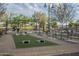 Community recreation area with horseshoe pits, benches, shade structures, and a playground in the background at 3661 E Appaloosa Dr, San Tan Valley, AZ 85140