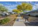 Neighborhood pathway lined with trees, shrubs, and a bench, offering residents a scenic outdoor space at 3661 E Appaloosa Dr, San Tan Valley, AZ 85140