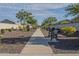 Neighborhood walkway lined with lush trees, shrubbery, and a bench offering a scenic outdoor space at 3661 E Appaloosa Dr, San Tan Valley, AZ 85140