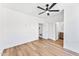 Empty bedroom featuring wood flooring and two doorways leading to an en-suite bathroom at 4220 N 32Nd St # 7, Phoenix, AZ 85018