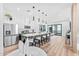 Bright, modern kitchen with stainless steel appliances, large island, and sleek white cabinets at 4220 N 32Nd St # 7, Phoenix, AZ 85018