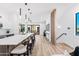 Open-concept living space with kitchen island seating, and access to outdoor balcony at 4220 N 32Nd St # 7, Phoenix, AZ 85018