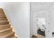 Elegant stairway with wood steps and ambient lighting leading to the second floor at 4220 N 32Nd St # 7, Phoenix, AZ 85018