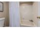 Bathroom featuring a shower and tub combo with sliding shower door at 4303 E Cactus Rd # 202, Phoenix, AZ 85032