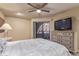 Bedroom with sliding glass doors leading to an outdoor space and a ceiling fan at 4303 E Cactus Rd # 202, Phoenix, AZ 85032