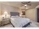 Neutral bedroom with a ceiling fan and soft, warm lighting at 4303 E Cactus Rd # 202, Phoenix, AZ 85032
