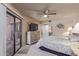 Bedroom with sliding glass doors, and an ensuite bathroom at 4303 E Cactus Rd # 202, Phoenix, AZ 85032