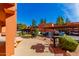 Outdoor lounge with built-in BBQs and mature shrubbery at 4303 E Cactus Rd # 202, Phoenix, AZ 85032