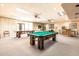 Large recreation room with pool table, ping pong table, and bar area for residents' entertainment at 4303 E Cactus Rd # 202, Phoenix, AZ 85032