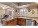 Bright eat-in kitchen with stainless steel dishwasher and double sink at 4303 E Cactus Rd # 202, Phoenix, AZ 85032