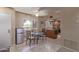 Dining room with tile flooring, island with sink, and a mini refrigerator at 4303 E Cactus Rd # 202, Phoenix, AZ 85032