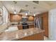 Traditional kitchen featuring stainless steel appliances, an island, and pendant lighting at 4303 E Cactus Rd # 202, Phoenix, AZ 85032