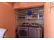 Laundry room featuring a washer, dryer, and storage at 4303 E Cactus Rd # 202, Phoenix, AZ 85032
