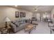 Cozy living room featuring carpet, a ceiling fan, and neutral paint colors at 4303 E Cactus Rd # 202, Phoenix, AZ 85032