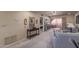 Spacious living room with a ceiling fan and access to the outdoor patio at 4303 E Cactus Rd # 202, Phoenix, AZ 85032