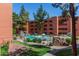 Resort-style pool area showcasing beautiful landscaping, rocky features, and multiple levels for relaxation at 4303 E Cactus Rd # 202, Phoenix, AZ 85032