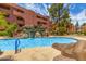 Exterior of complex, displaying the pool and waterfall at 4303 E Cactus Rd # 202, Phoenix, AZ 85032