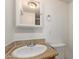 Bathroom with a decorative framed mirror, granite-look countertop, and modern fixtures at 452 S Horne --, Mesa, AZ 85204