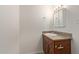 Bright bathroom featuring a vanity with storage, a decorative framed mirror, and modern fixtures at 452 S Horne --, Mesa, AZ 85204