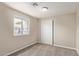 Cozy bedroom with neutral carpet, closet, and bright window for natural light at 452 S Horne --, Mesa, AZ 85204