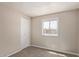 Bedroom featuring carpet, a closet door, and bright natural light from the window at 452 S Horne --, Mesa, AZ 85204