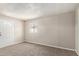 Spacious bedroom with neutral walls, plush carpet, a window, and a door leading to the outside at 452 S Horne --, Mesa, AZ 85204