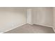 Carpeted bedroom with neutral colors and white door; minimal design at 452 S Horne --, Mesa, AZ 85204