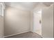 Cozy bedroom with neutral walls, plush carpeting, and a view into another room at 452 S Horne --, Mesa, AZ 85204