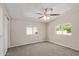 Bright bedroom featuring plush carpeting, a modern ceiling fan and plenty of natural light from its windows at 452 S Horne --, Mesa, AZ 85204