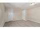Bedroom featuring neutral walls, plush carpet, and two doors for easy access and exit at 452 S Horne --, Mesa, AZ 85204