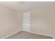 Bedroom with neutral walls, carpeted floors, and simple door at 452 S Horne --, Mesa, AZ 85204