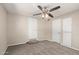Cozy bedroom featuring a ceiling fan, neutral walls, and two convenient closets for ample storage at 452 S Horne --, Mesa, AZ 85204
